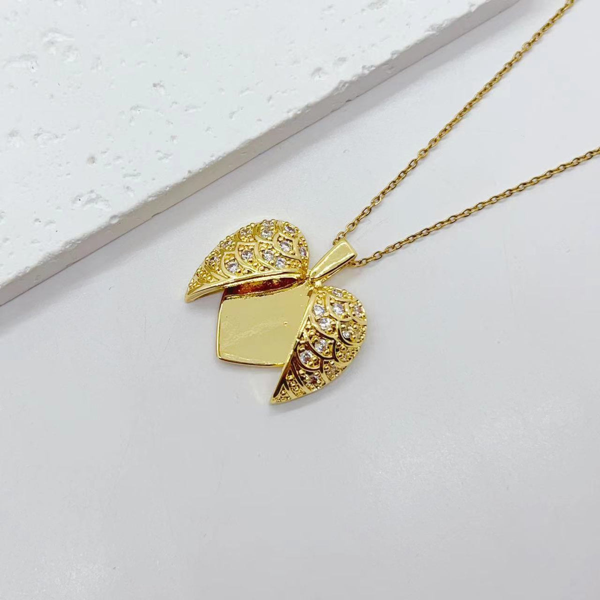 Collana acciaio titanio cuore farfalla girasole