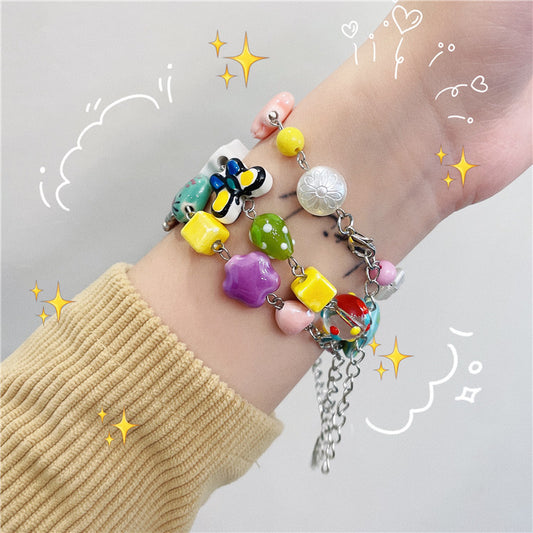 Bracciale farfalla e fiore con perline