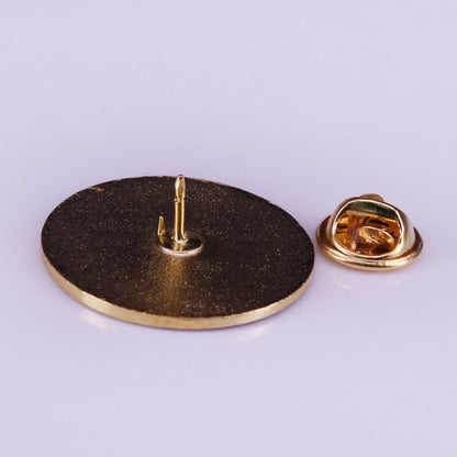 Spilla rotonda in bronzo
