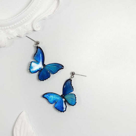 Orecchini farfalla blu con perle