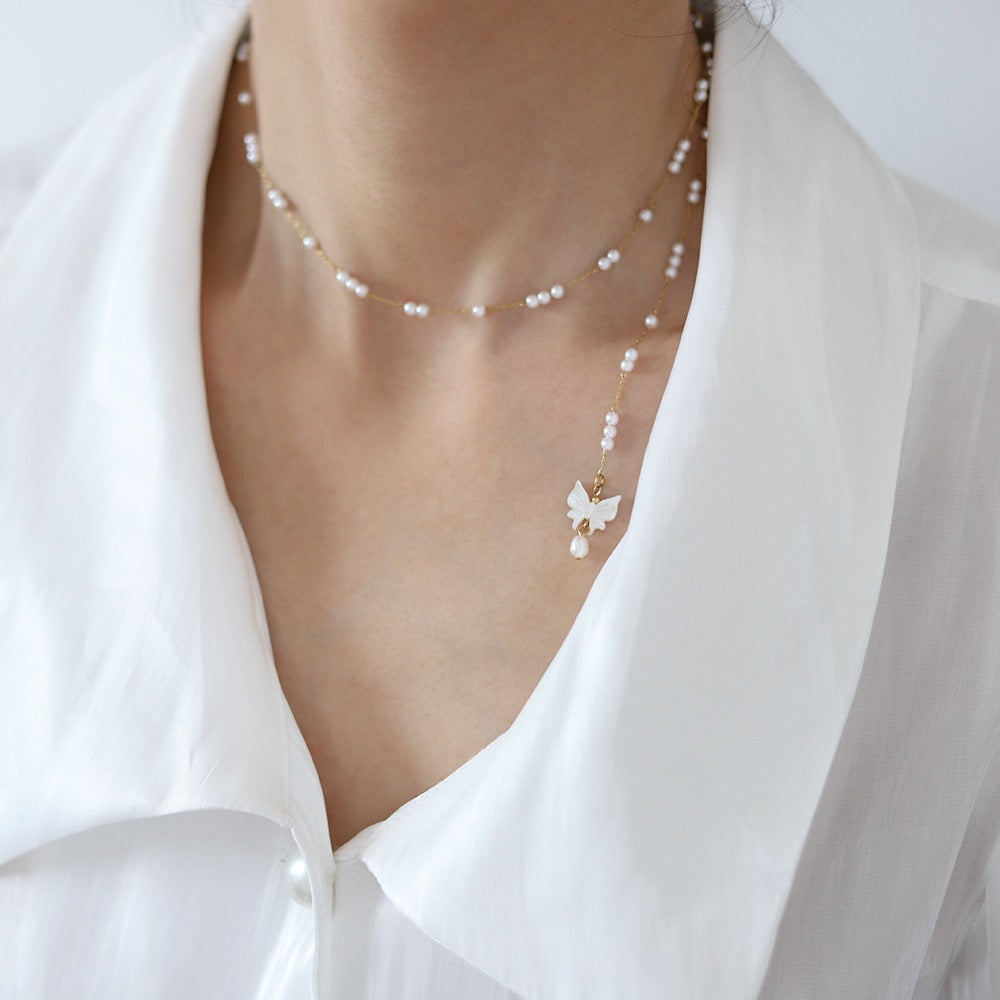 Collana con farfalla e perle