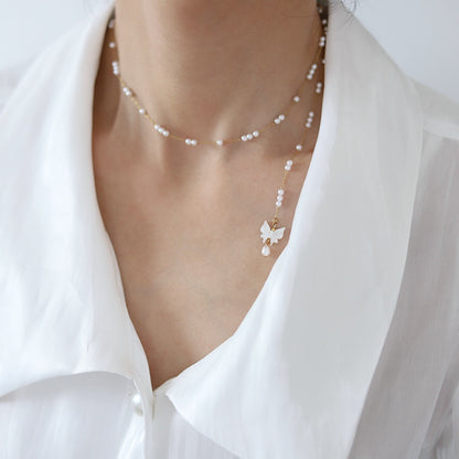 Collana con farfalla e perle