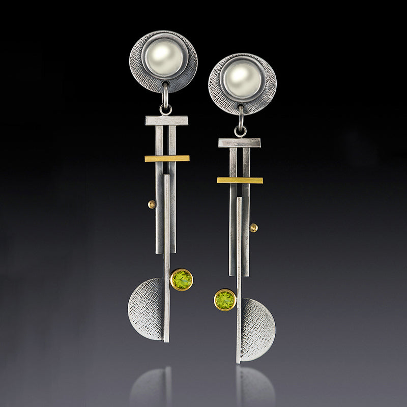 Orecchini geometrici con nappina argento antico