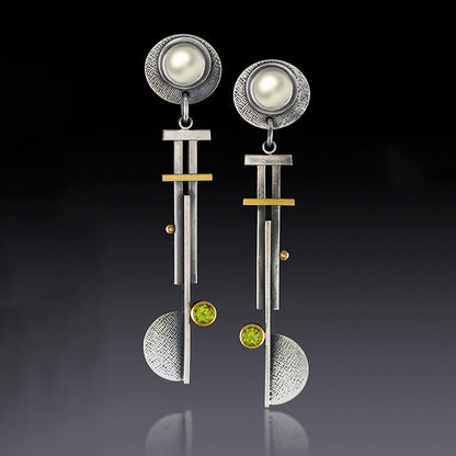 Orecchini geometrici con nappina argento antico
