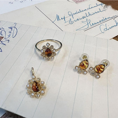 Anello argento dorato con fiore e ambra