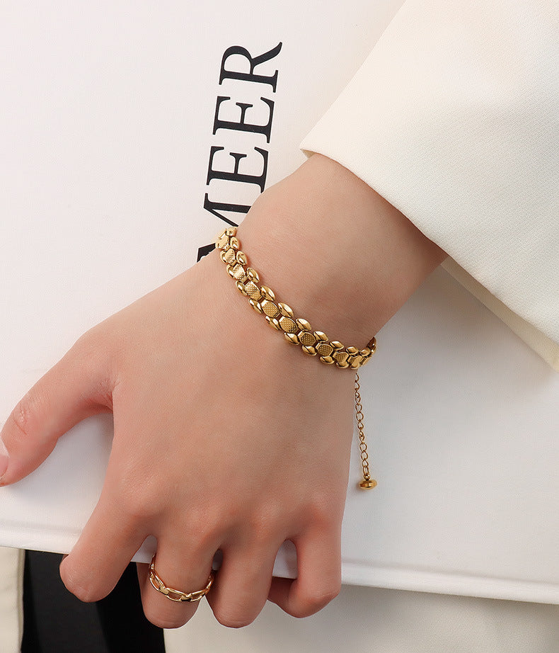 Bracciale titanio oro 18K