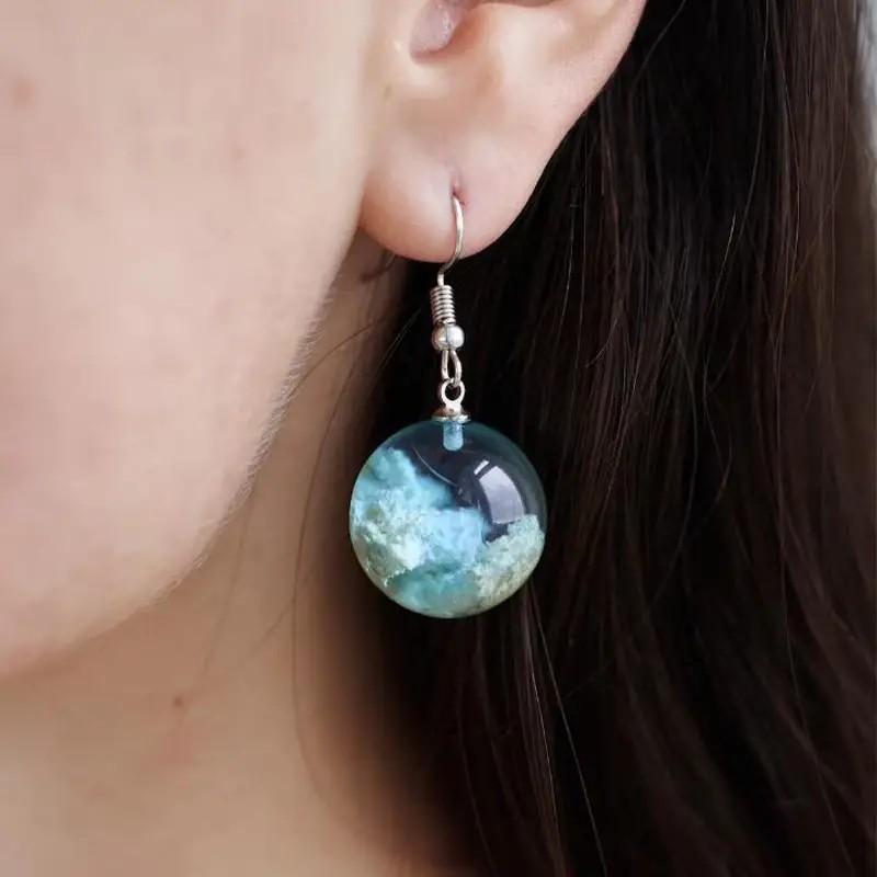 Orecchini sfera trasparente stile Mori