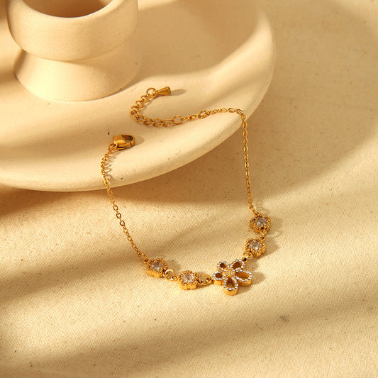 Braccialetto in acciaio oro con zircone fiore
