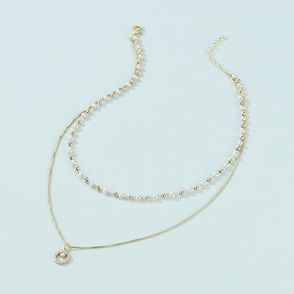 Collana anello doppia perla