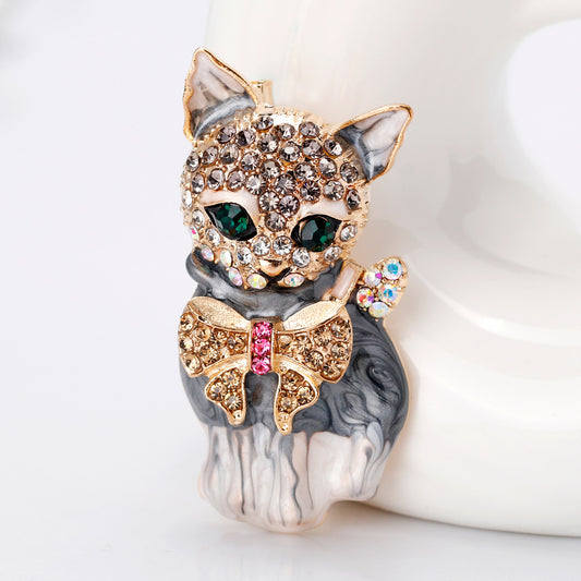 Spilla gatto con occhi verdi