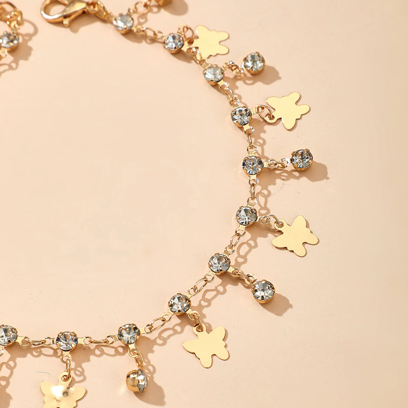 Cavigliera farfalla nappina con strass