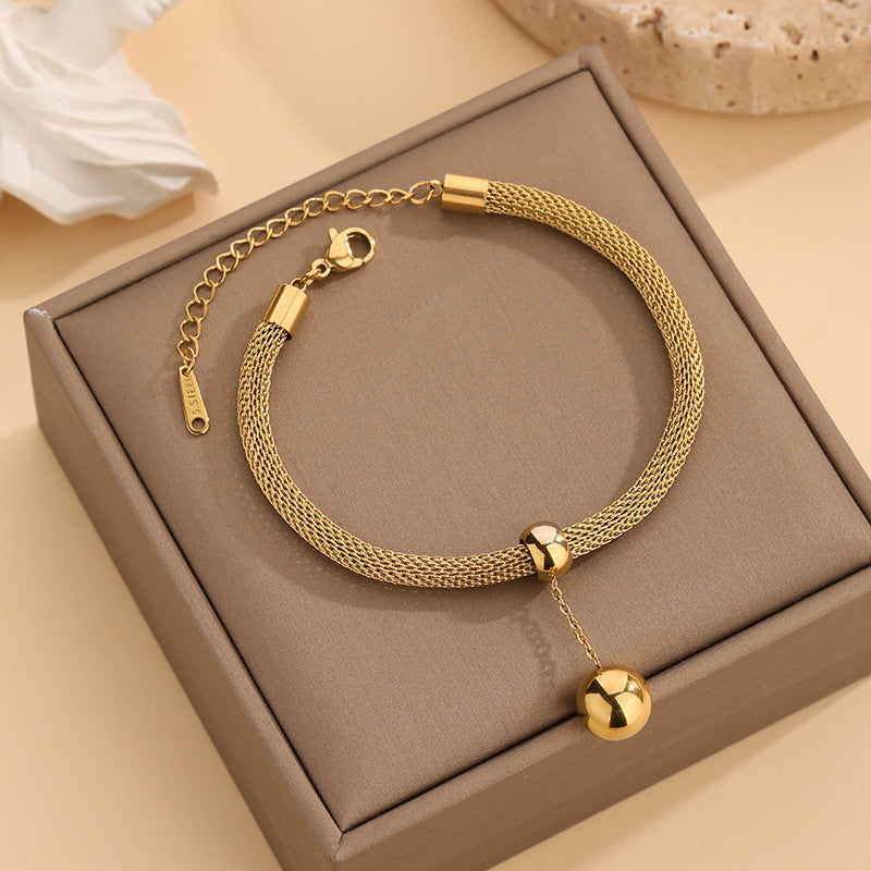 Collana sfere dorate con nappa