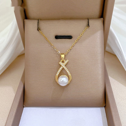 Collana croce con perla e strass