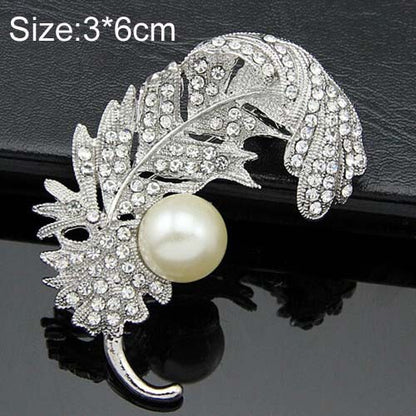 Spilla piuma con strass