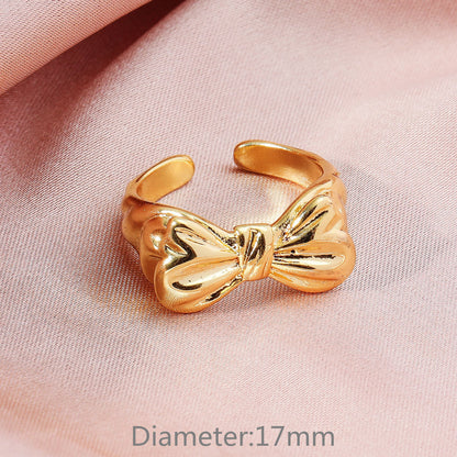 Anello fiocco aperto placcato oro