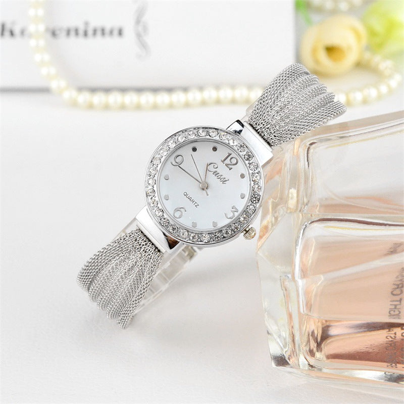Orologio con cinturino a maglie dorate