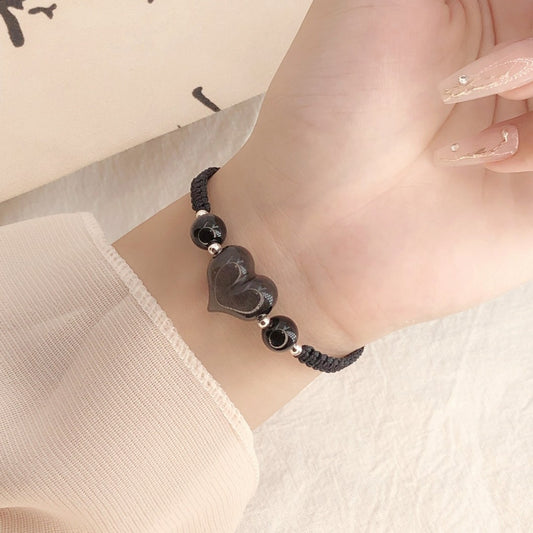 Braccialetto argento intrecciato da donna cuore nero