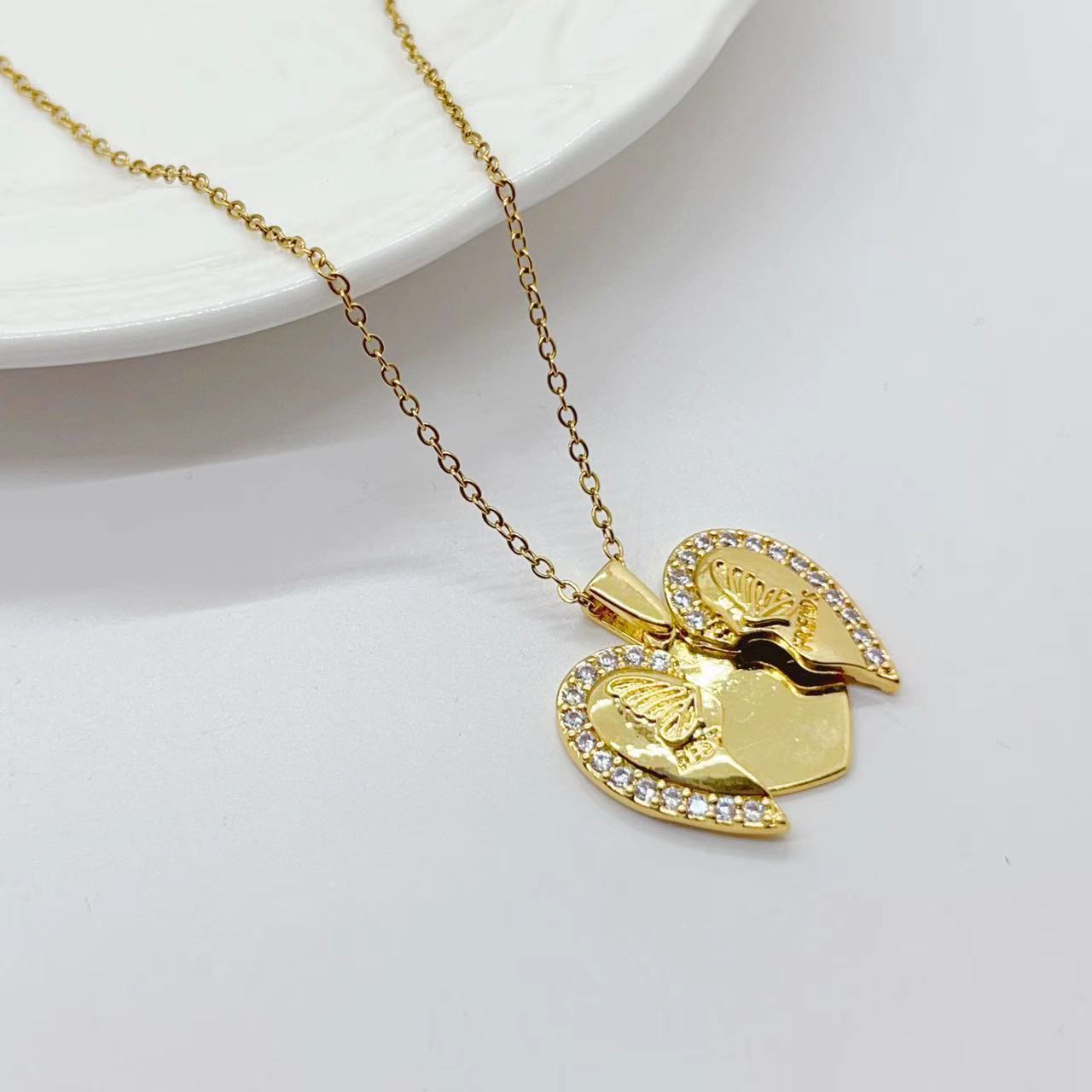 Collana acciaio titanio cuore farfalla girasole