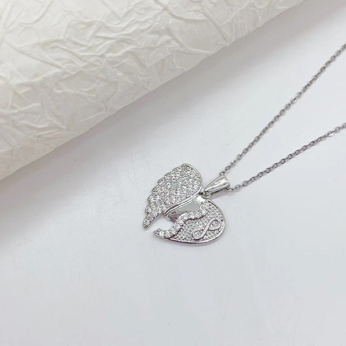 Collana acciaio titanio cuore farfalla girasole