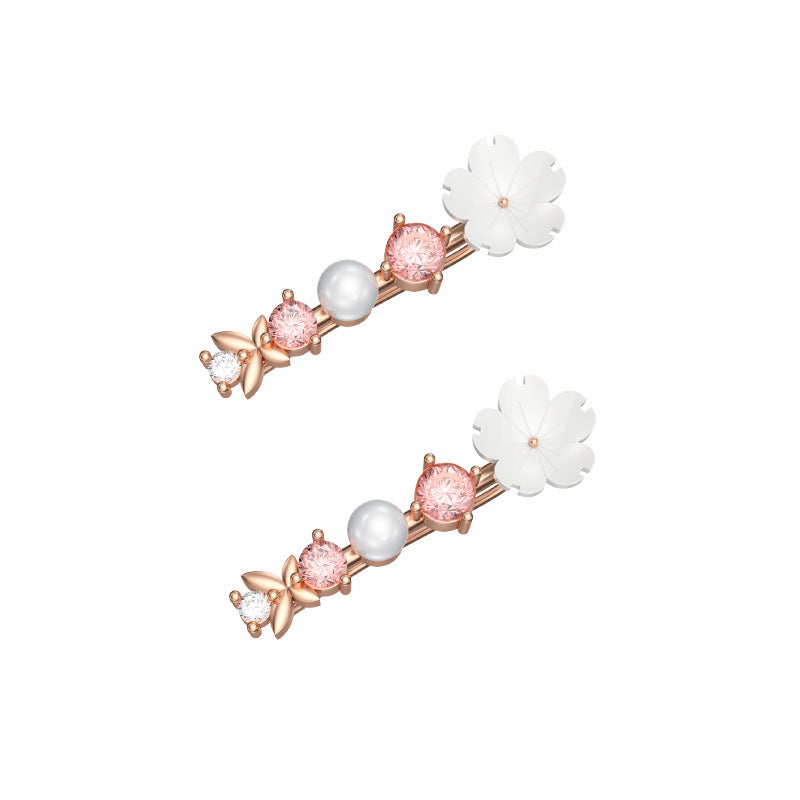 Orecchini farfalla e fiore con perla