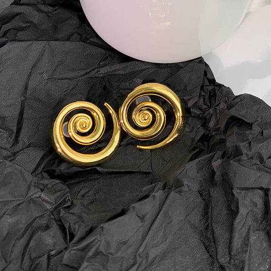Orecchini geometrici oro rotazione