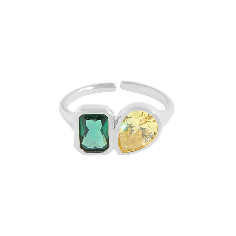 Anello smeraldo e zircone geometrico