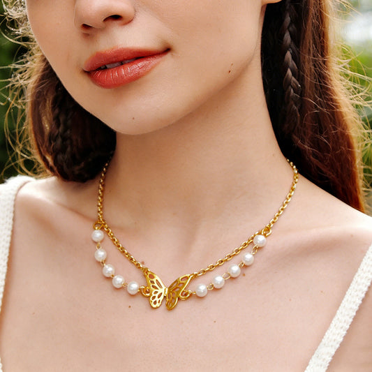 Collana farfalla e perle multistrato