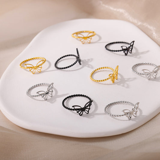Anello farfalla e croce intrecciato