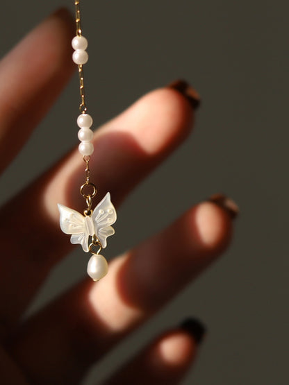 Collana con farfalla e perle