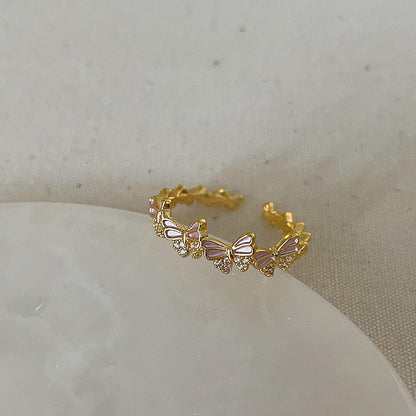 Anello farfalla e fiore viola