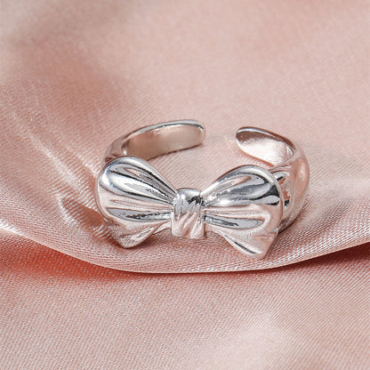 Anello fiocco aperto placcato oro