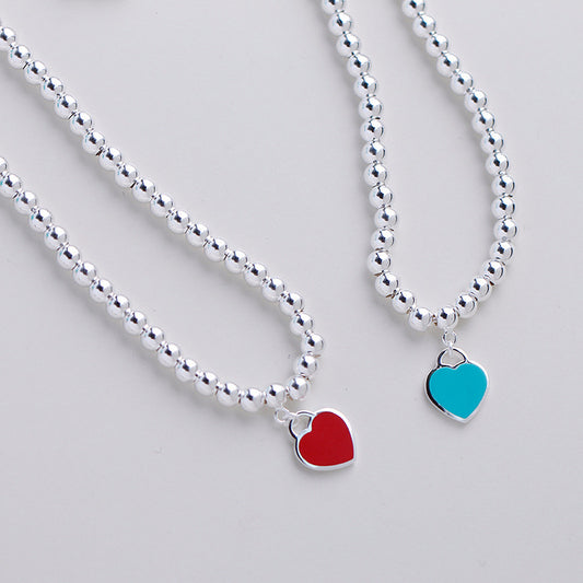 Collana Buddha con cuori smaltati blu