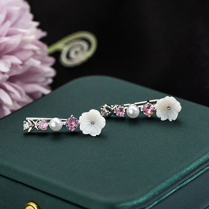 Orecchini farfalla e fiore con perla