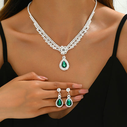 Set collana e orecchini goccia e fiore con cristalli