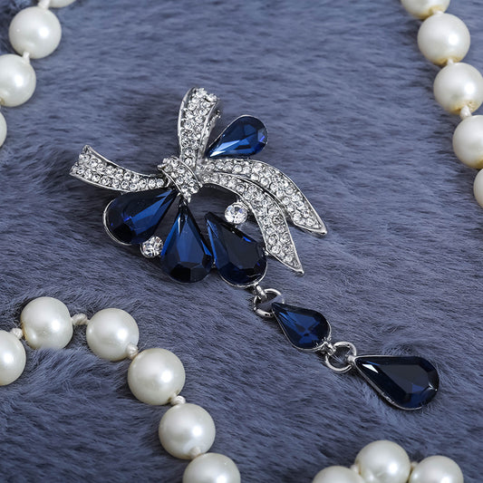 Spilla fiocco azzurro cristalli