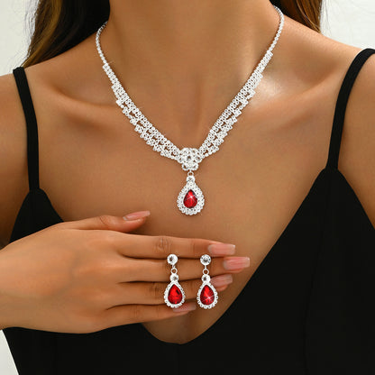 Set collana e orecchini goccia e fiore con cristalli
