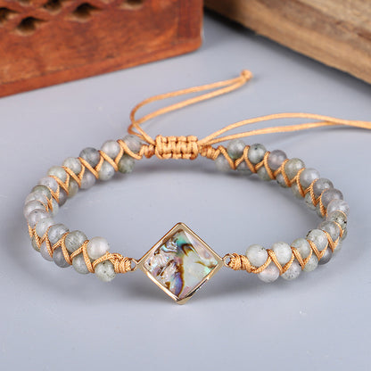 Bracciale intrecciato conchiglia e pietre