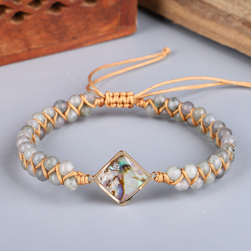 Bracciale intrecciato conchiglia e pietre