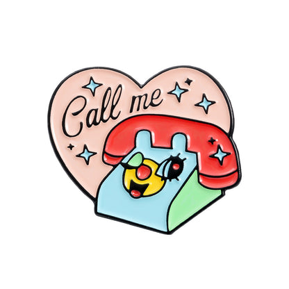 Spilla cuore con telefono