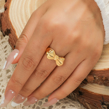 Anello fiocco aperto placcato oro