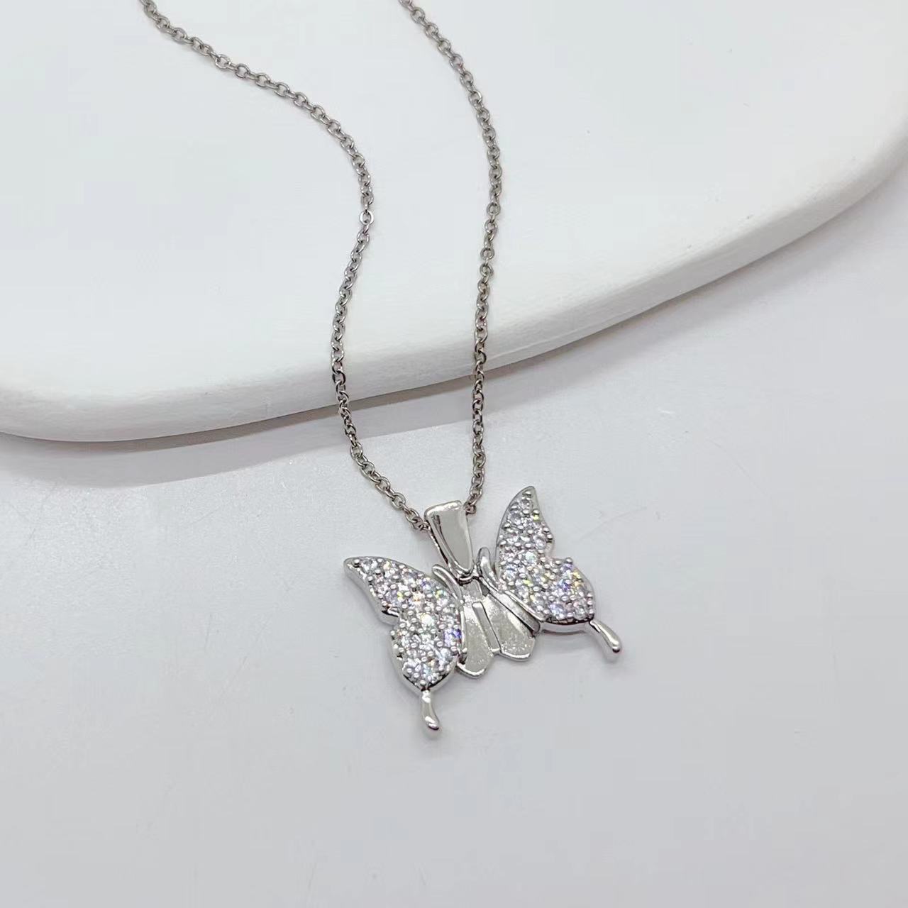 Collana acciaio titanio cuore farfalla girasole