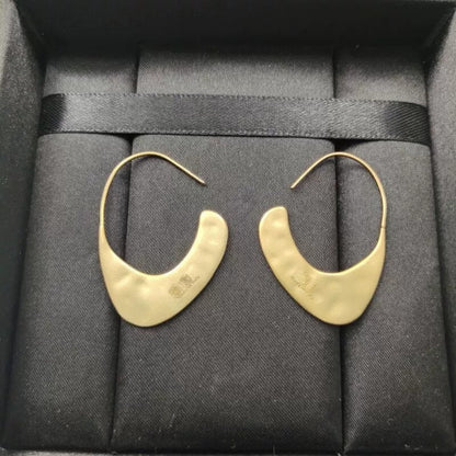 Orecchini geometrici dorati in ottone
