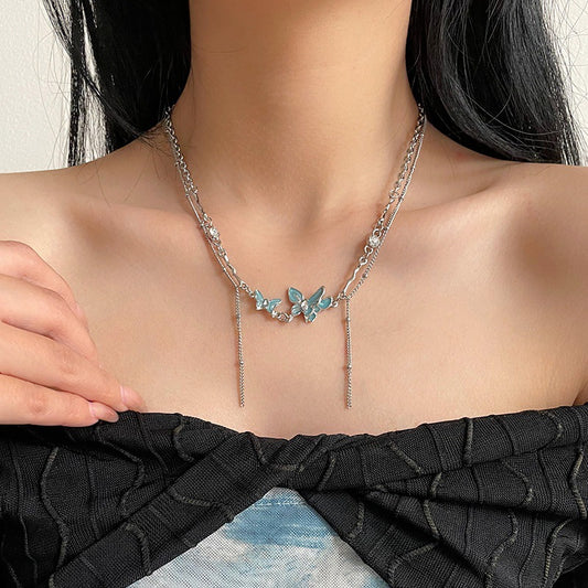 Collana farfalla blu con nappa