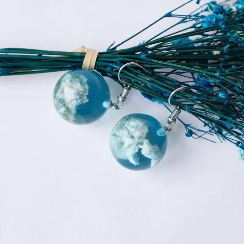 Orecchini sfera trasparente stile Mori