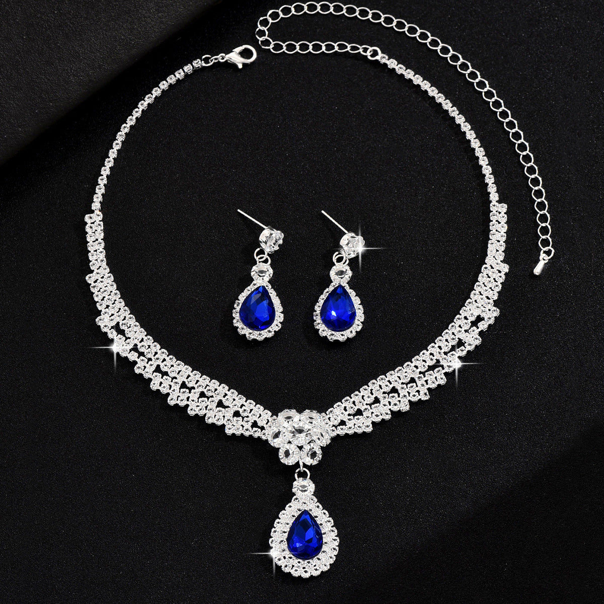 Set collana e orecchini goccia e fiore con cristalli
