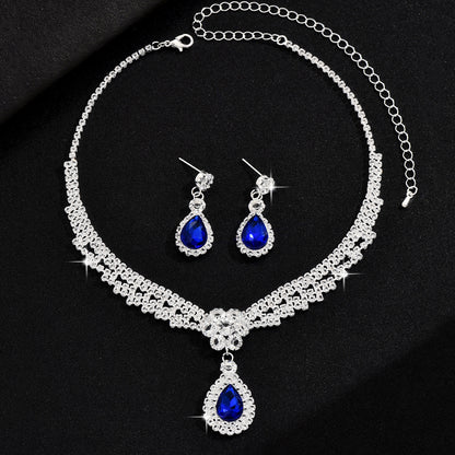 Set collana e orecchini goccia e fiore con cristalli