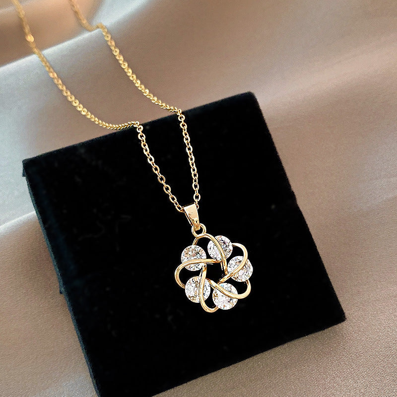 Collana fiore geometrico titanio