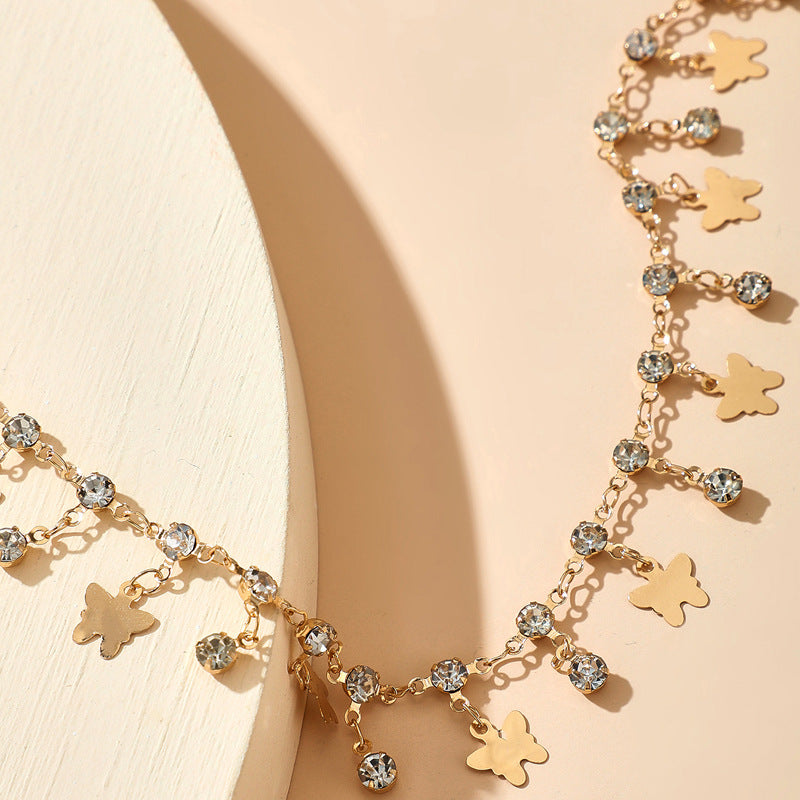 Cavigliera farfalla nappina con strass