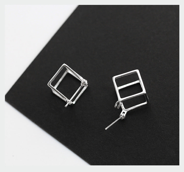 Orecchini cubi traforati argento