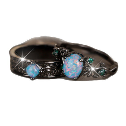 Anello uovo oro nero cristalli blu